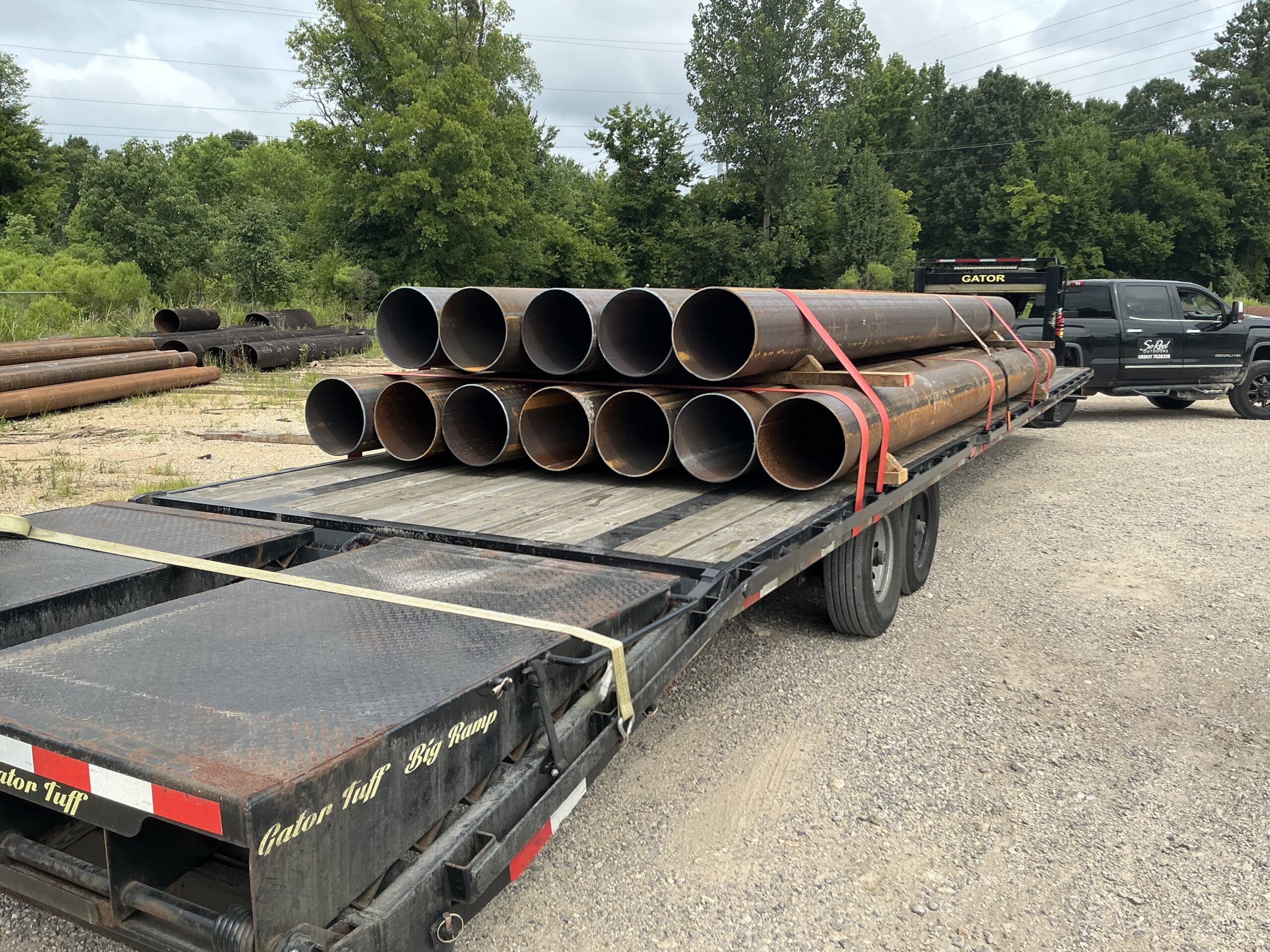 Pipe load strapped on a 40 foot hotshot flatbed